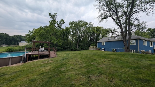 5N119 Mary Ct, Saint Charles, IL 60175 - view of green lawn featuring an outdoor pool, a pergola, and a deck