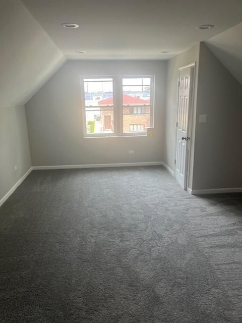 1405 N 24th Ave, Melrose Park, IL 60160 - bonus room with lofted ceiling and dark colored carpet