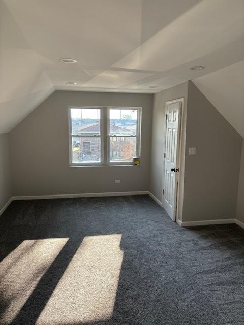 1405 N 24th Ave, Melrose Park, IL 60160 - additional living space featuring dark carpet and vaulted ceiling