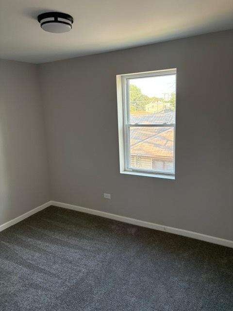 1405 N 24th Ave, Melrose Park, IL 60160 - spare room with dark colored carpet