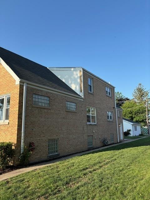 1405 N 24th Ave, Melrose Park, IL 60160 - view of side of property featuring a yard and brick siding