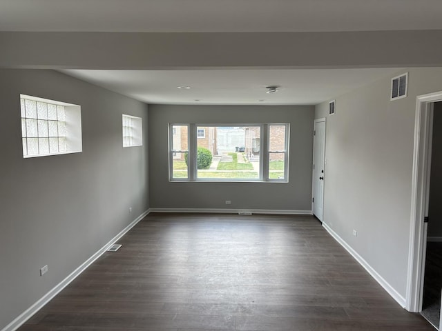 1405 N 24th Ave, Melrose Park, IL 60160 - unfurnished room with dark wood-style flooring