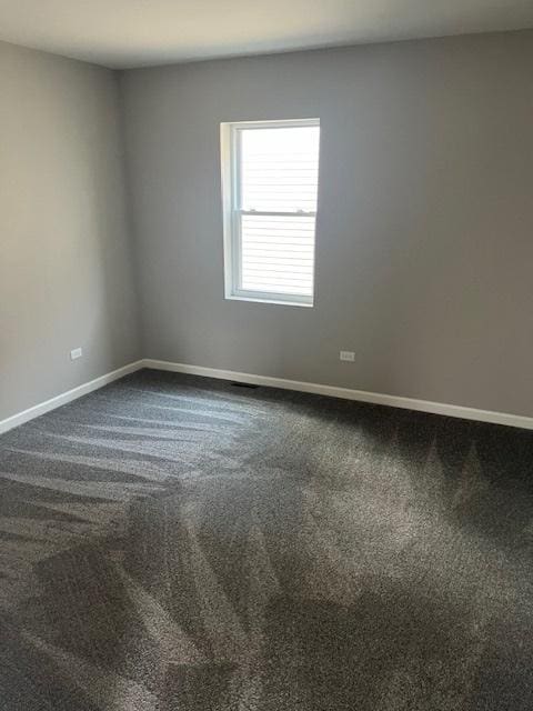 1405 N 24th Ave, Melrose Park, IL 60160 - empty room featuring dark carpet and baseboards