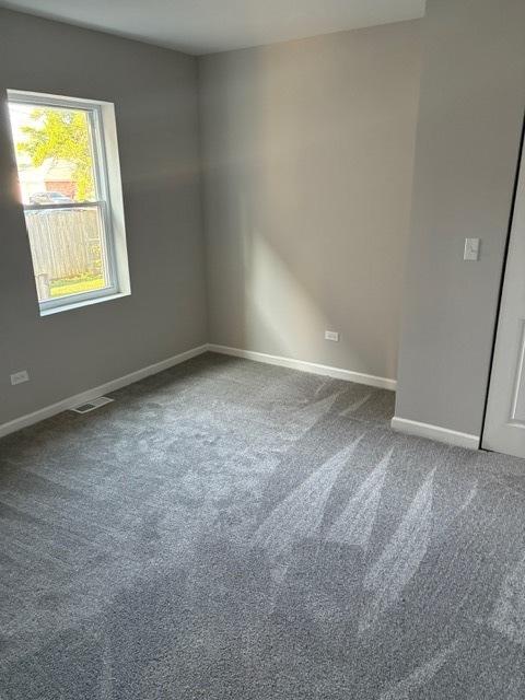 1405 N 24th Ave, Melrose Park, IL 60160 - unfurnished room featuring carpet flooring and baseboards