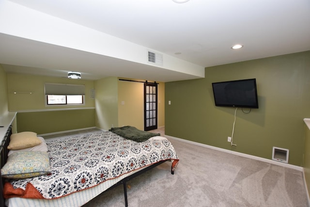 1116 Oakleaf Ave, Mchenry, IL 60051 - carpeted bedroom featuring a barn door and recessed lighting