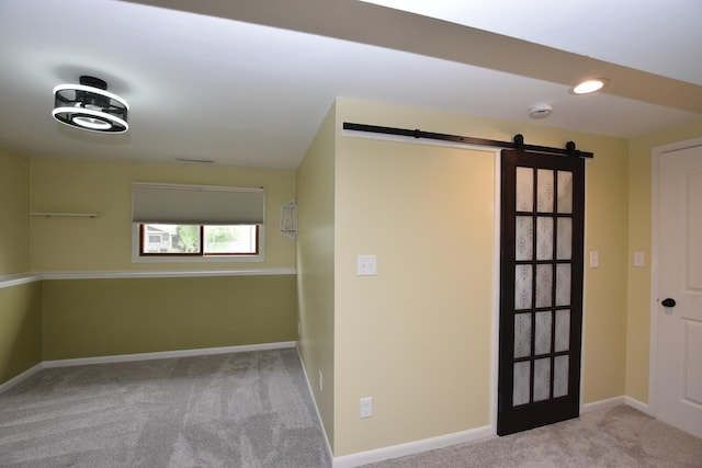 1116 Oakleaf Ave, Mchenry, IL 60051 - carpeted spare room with a barn door and baseboards
