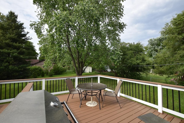 1116 Oakleaf Ave, Mchenry, IL 60051 - deck featuring a storage unit, outdoor dining area, and a lawn