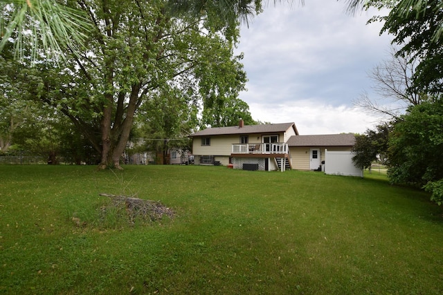 1116 Oakleaf Ave, Mchenry, IL 60051 - rear view of property featuring a deck, a yard, and a chimney