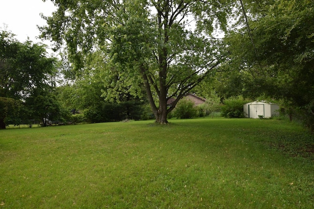 1116 Oakleaf Ave, Mchenry, IL 60051 - view of green lawn featuring a storage unit