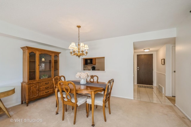 1295 N Sterling Ave Unit 211, Palatine, IL 60067 - dining area featuring a chandelier and light carpet