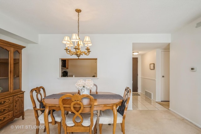 1295 N Sterling Ave Unit 211, Palatine, IL 60067 - dining room featuring a chandelier, light carpet, and light tile patterned floors