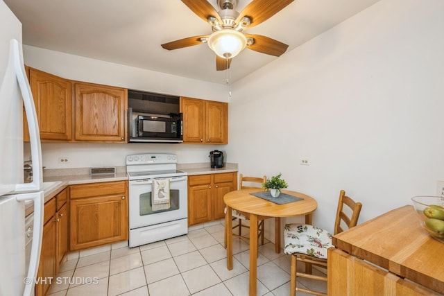 1295 N Sterling Ave Unit 211, Palatine, IL 60067 - kitchen featuring white appliances, light tile patterned flooring, light countertops, brown cabinets, and a ceiling fan