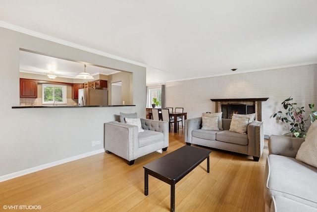 340 Claymoor Rd Unit 2B, Hinsdale, IL 60521 - living area featuring plenty of natural light, light wood finished floors, ornamental molding, and brick wall