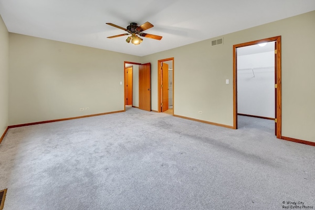 646 Schooner Ln, Elk Grove Village, IL 60007 - unfurnished bedroom with a spacious closet, carpet flooring, ceiling fan, and a closet