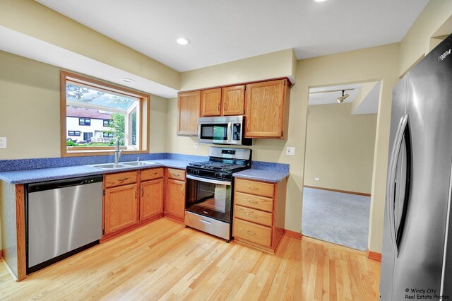 646 Schooner Ln, Elk Grove Village, IL 60007 - kitchen with appliances with stainless steel finishes, light wood finished floors, and recessed lighting
