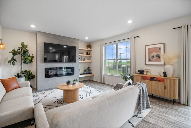 1462 Keller St, Elburn, IL 60119 - living area featuring light wood-type flooring, recessed lighting, and a fireplace