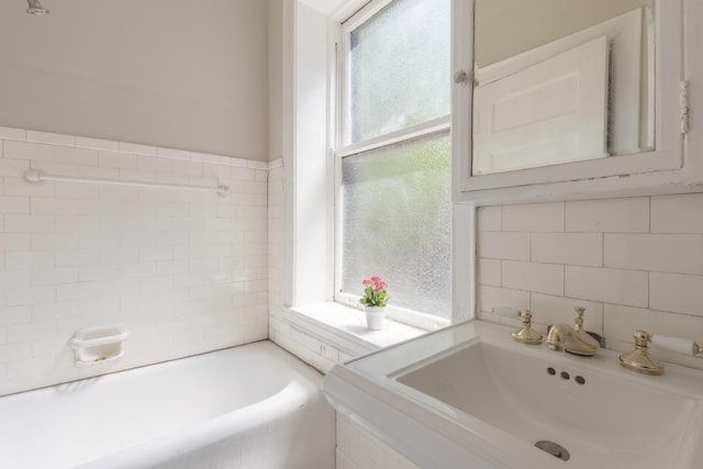 668 W Irving Park Rd Unit H1, Chicago, IL 60613 - bathroom with a tub, vanity, tile walls, and backsplash
