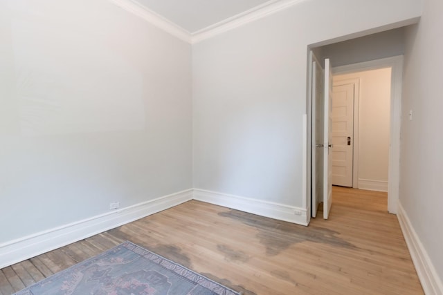 668 W Irving Park Rd Unit H1, Chicago, IL 60613 - empty room with ornamental molding and light wood-style flooring
