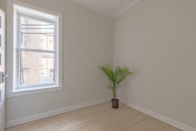 668 W Irving Park Rd Unit H1, Chicago, IL 60613 - unfurnished room with crown molding and wood finished floors