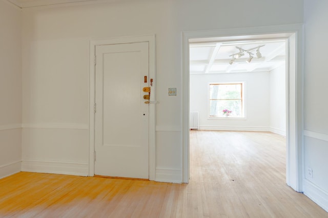 668 W Irving Park Rd Unit H1, Chicago, IL 60613 - entryway with radiator, light wood-style flooring, coffered ceiling, beam ceiling, and a chandelier