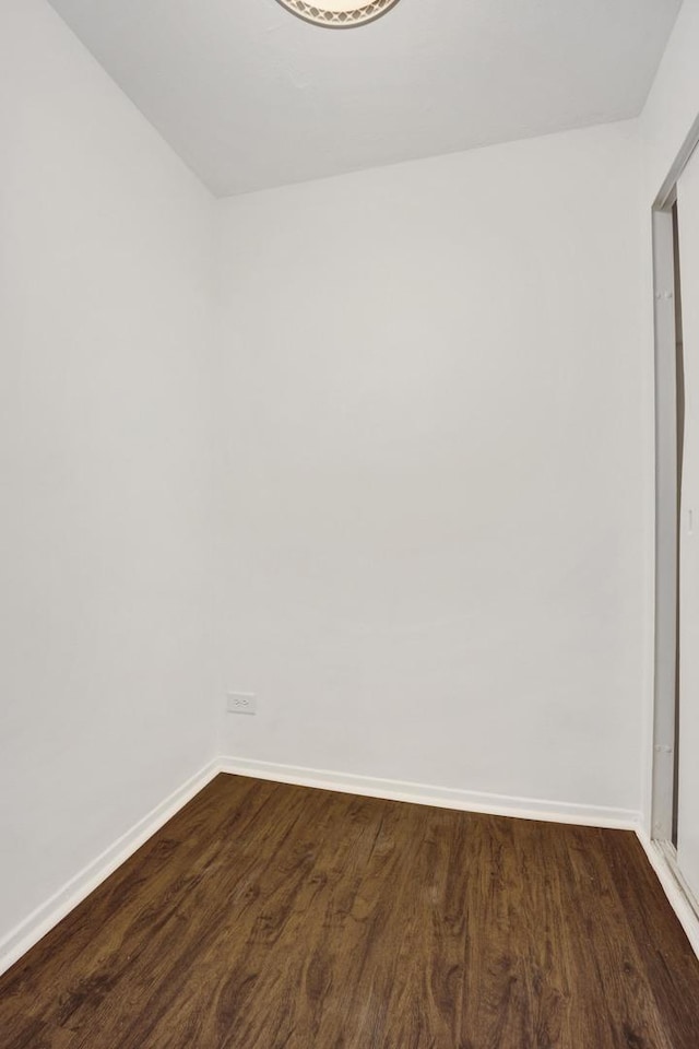 3100 N Lake Shore Dr Unit 413, Chicago, IL 60657 - unfurnished room featuring baseboards and dark wood-style flooring