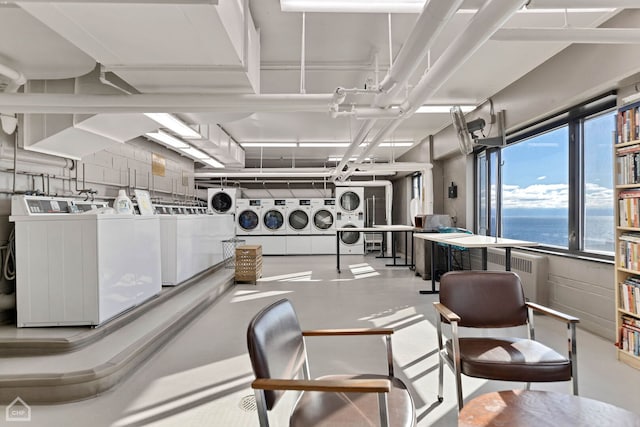3100 N Lake Shore Dr Unit 413, Chicago, IL 60657 - miscellaneous room with concrete flooring, a water view, washing machine and clothes dryer, and stacked washer / dryer