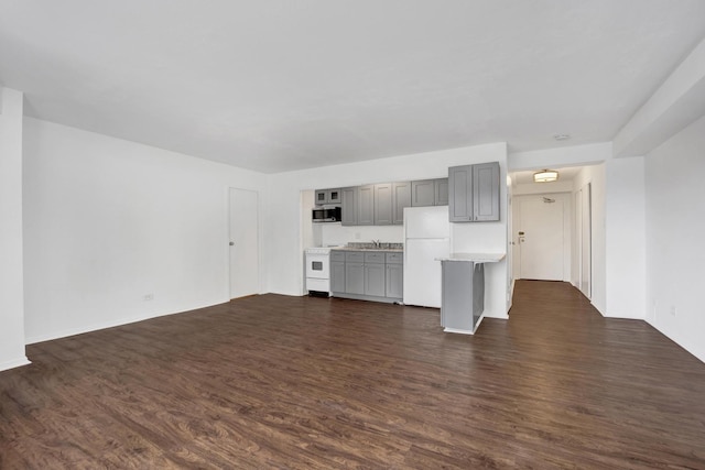 3100 N Lake Shore Dr Unit 413, Chicago, IL 60657 - unfurnished living room featuring dark wood-style floors and a sink