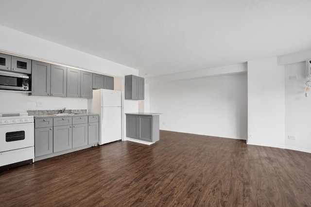 3100 N Lake Shore Dr Unit 413, Chicago, IL 60657 - kitchen featuring white appliances, gray cabinets, dark wood-style floors, and light countertops