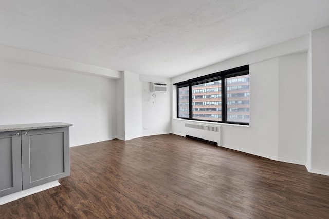 3100 N Lake Shore Dr Unit 413, Chicago, IL 60657 - unfurnished room featuring radiator, dark wood finished floors, and a wall mounted AC