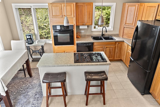 10405 Kenilworth Ave, Algonquin, IL 60102 - kitchen with black appliances, light countertops, a kitchen island, and light tile patterned floors