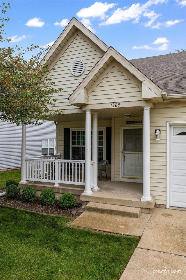 1909 Lakeside Dr, Montgomery, IL 60538 - view of front of property featuring covered porch and a shingled roof