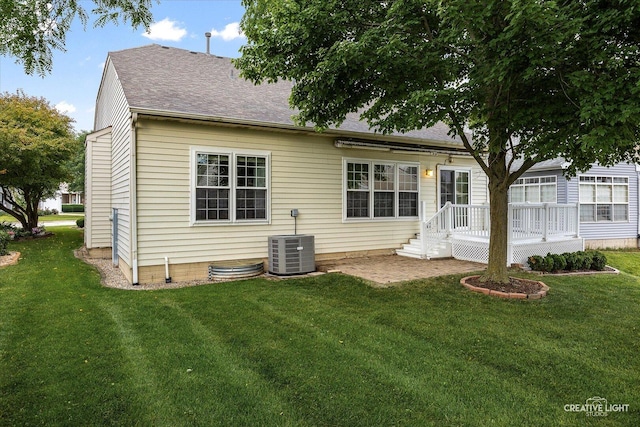 1909 Lakeside Dr, Montgomery, IL 60538 - back of property featuring a yard and a shingled roof