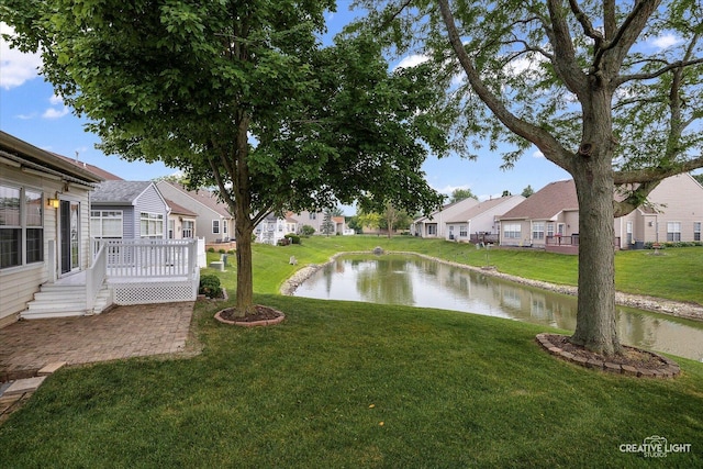 1909 Lakeside Dr, Montgomery, IL 60538 - view of grassy yard with a residential view and a deck with water view