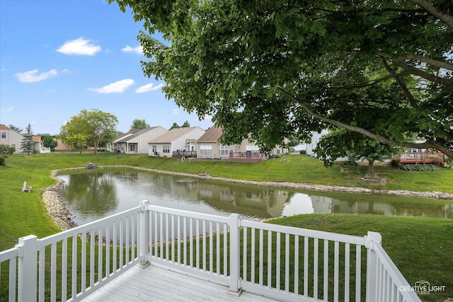 1909 Lakeside Dr, Montgomery, IL 60538 - wooden terrace with a water view, a lawn, and a residential view