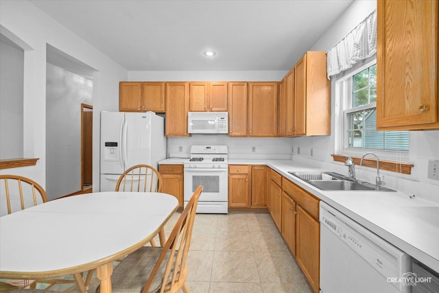 1909 Lakeside Dr, Montgomery, IL 60538 - kitchen featuring white appliances, light countertops, light tile patterned flooring, and brown cabinetry