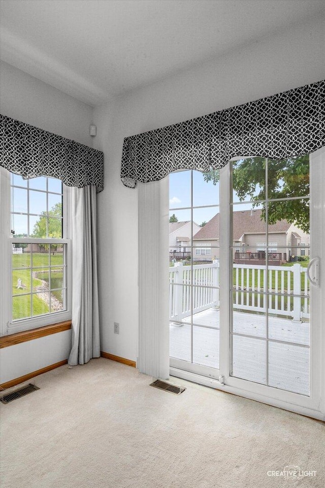 1909 Lakeside Dr, Montgomery, IL 60538 - spare room featuring carpet and baseboards