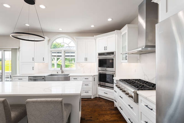 3527 Scottsdale Cir, Naperville, IL 60564 - kitchen featuring stainless steel appliances, wall chimney exhaust hood, recessed lighting, white cabinets, and dark wood-type flooring