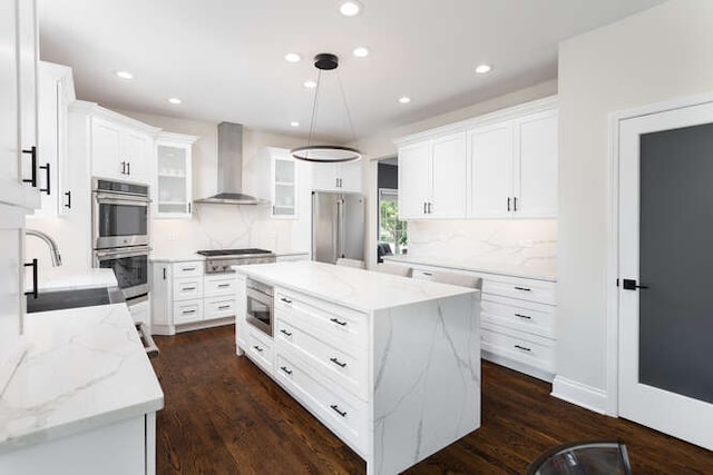 3527 Scottsdale Cir, Naperville, IL 60564 - kitchen featuring wall chimney range hood, appliances with stainless steel finishes, recessed lighting, tasteful backsplash, and glass insert cabinets