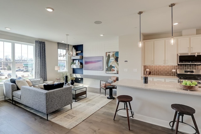 1058 E Oakton St, Des Plaines, IL 60018 - living room with dark wood-type flooring, recessed lighting, and a chandelier