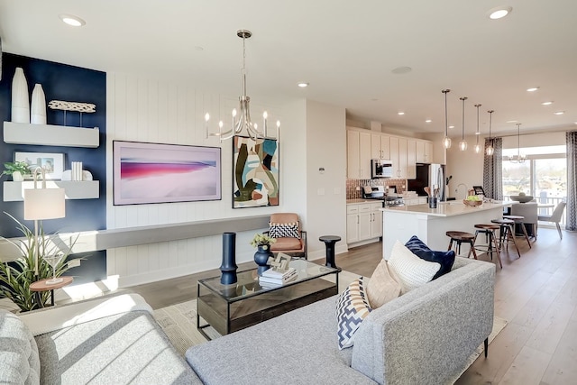 1058 E Oakton St, Des Plaines, IL 60018 - living area with a chandelier, light wood-type flooring, and recessed lighting