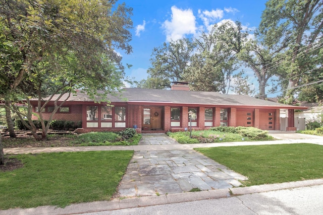 1020 S Knight Ave, Park Ridge, IL 60068 - view of front of house with brick siding, driveway, and a front lawn