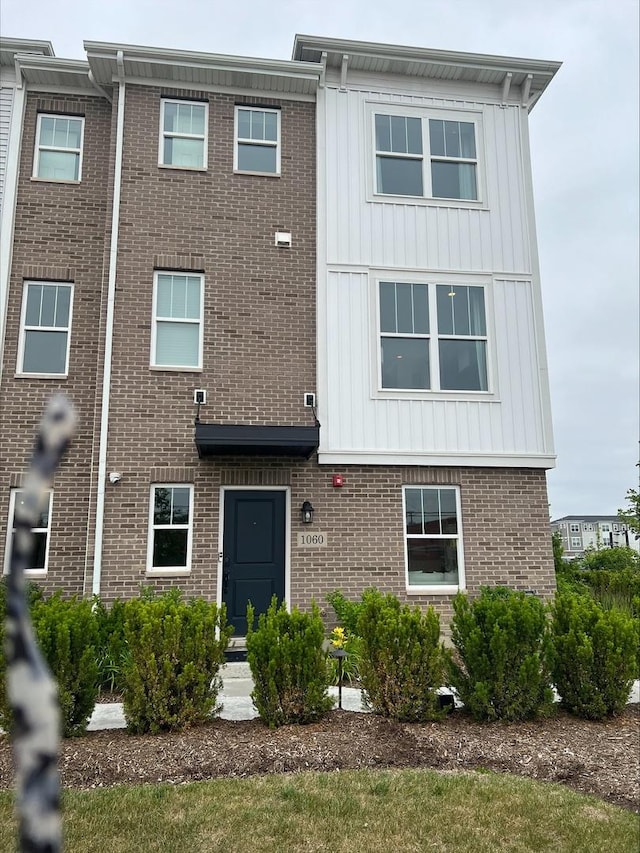1060 E Oakton St, Des Plaines, IL 60018 - view of front of property featuring brick siding and board and batten siding