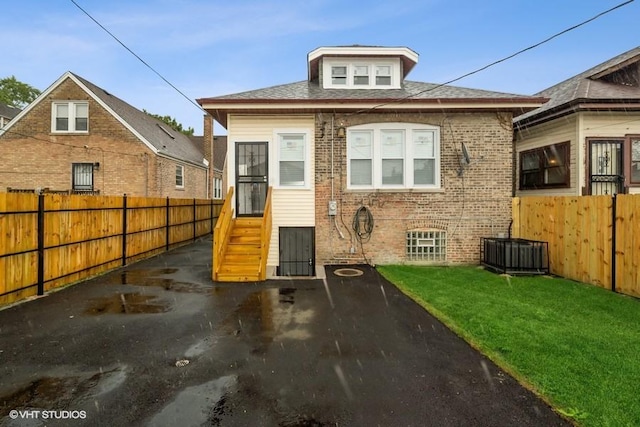 8108 S Wolcott Ave, Chicago, IL 60620 - back of property featuring a fenced backyard and brick siding
