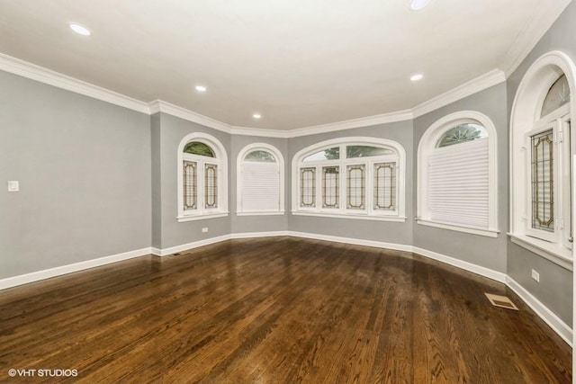 8108 S Wolcott Ave, Chicago, IL 60620 - spare room featuring dark wood-style flooring, recessed lighting, ornamental molding, and plenty of natural light