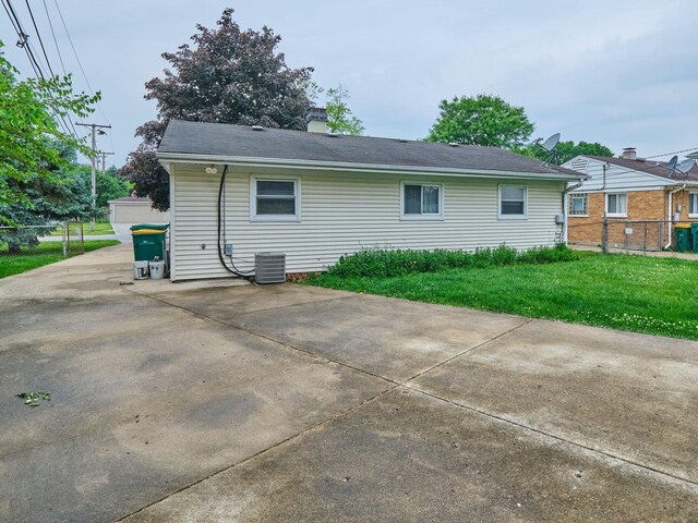 109 George Rd, Wheeling, IL 60090 - rear view of property featuring a chimney and a patio area
