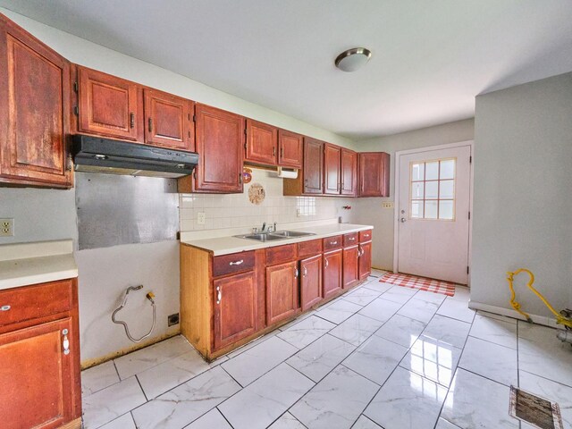 109 George Rd, Wheeling, IL 60090 - kitchen with under cabinet range hood, light marble finish flooring, light countertops, and decorative backsplash