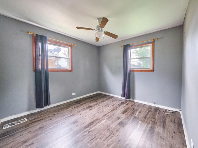 109 George Rd, Wheeling, IL 60090 - spare room featuring healthy amount of natural light, wood finished floors, and a ceiling fan