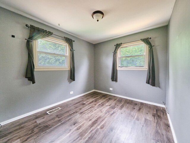 109 George Rd, Wheeling, IL 60090 - empty room with plenty of natural light and wood finished floors