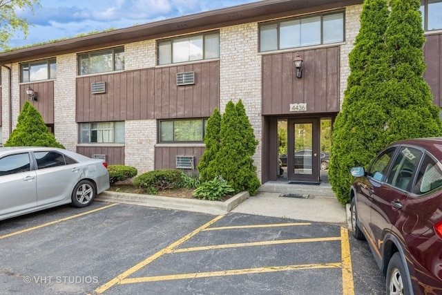 4436 Arbor Cir Unit 4, Downers Grove, IL 60515 - view of building exterior with uncovered parking