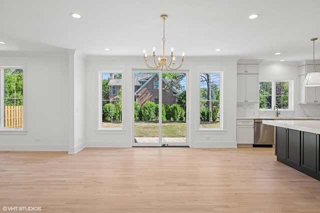 900 Pleasant Ln, Glenview, IL 60025 - unfurnished dining area featuring light wood-style flooring, plenty of natural light, recessed lighting, and crown molding